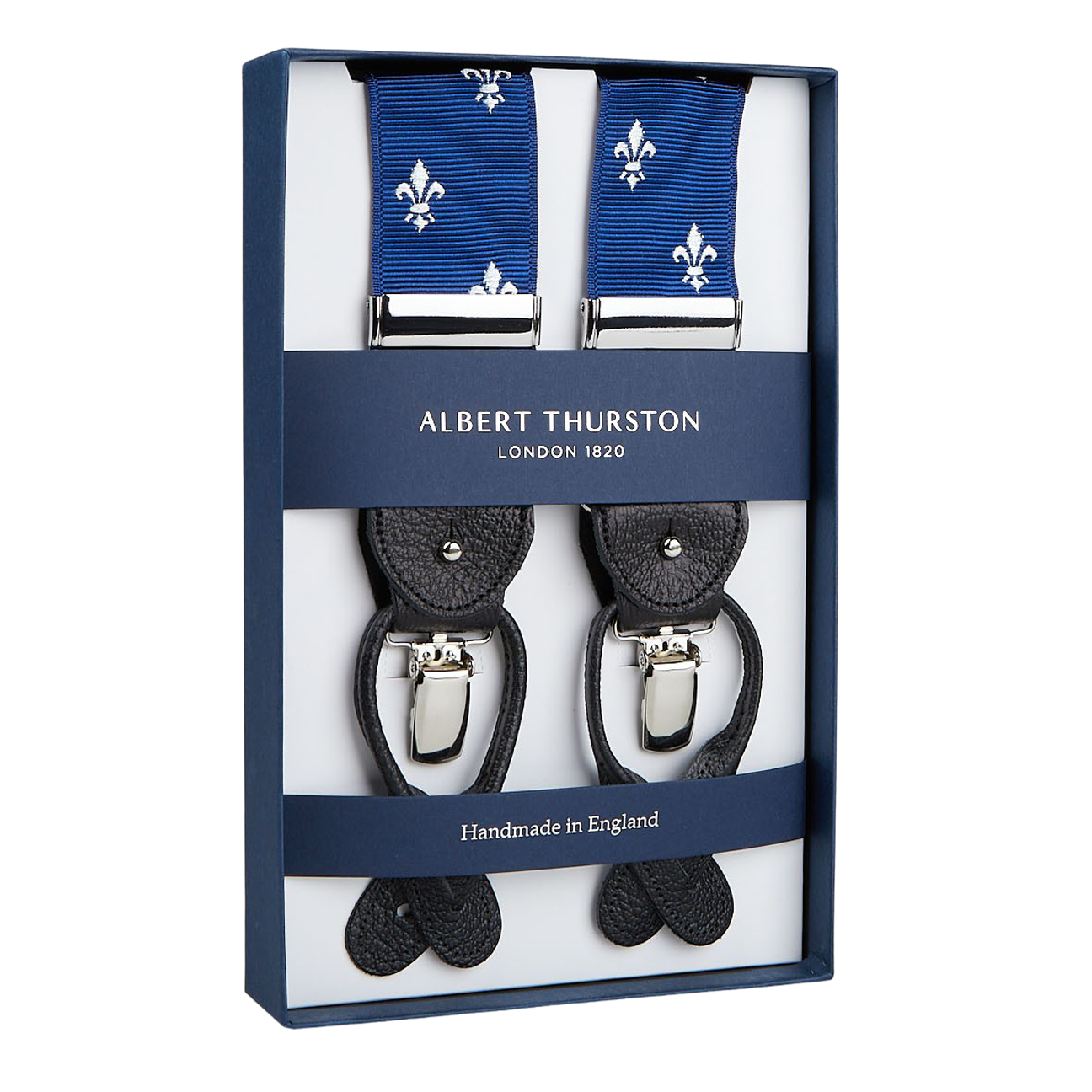 A box encases Albert Thurston's "Blue with White French Lily 40mm Braces," featuring black leather ends and silver clips. The label states "Albert Thurston London 1820" and "Handmade in England," epitomizing an elegant wardrobe essential.