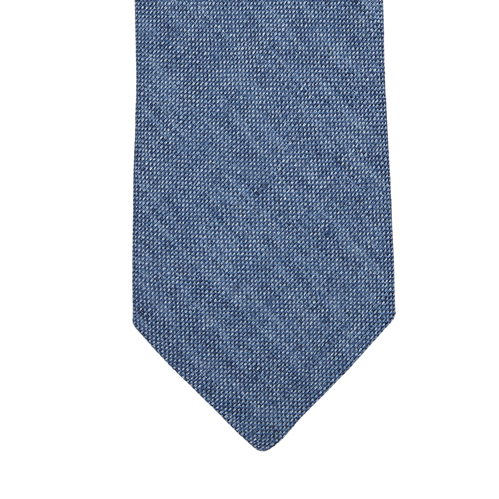 An Amanda Christensen Denim Blue Melange Linen Lined Tie in a denim blue shade on a white background.