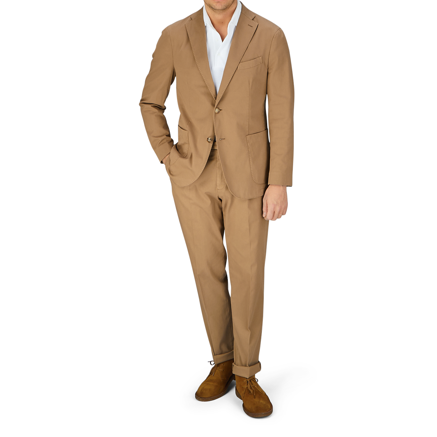 A man wearing a tan Boglioli Tobacco Brown Washed Cotton K Jacket and brown shoes stands against a light-colored background.