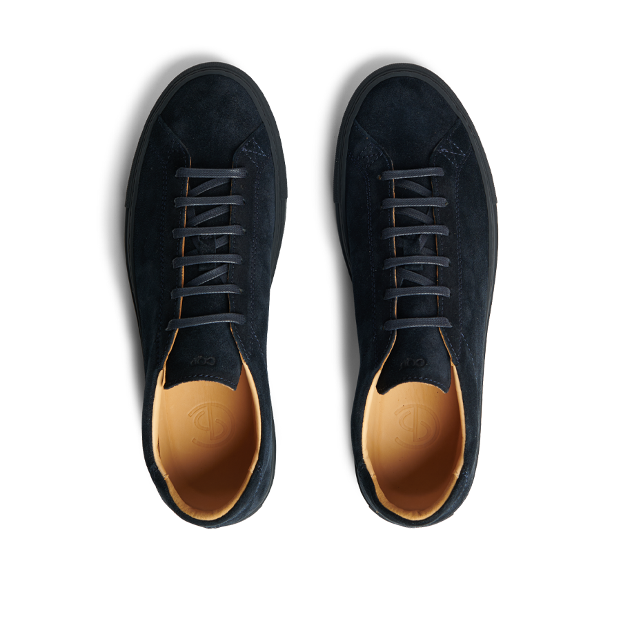 A pair of All Blue Suede Leather Racquet Sr Sneakers by CQP, with brown inner lining, white laces, and added arch support, viewed from above.