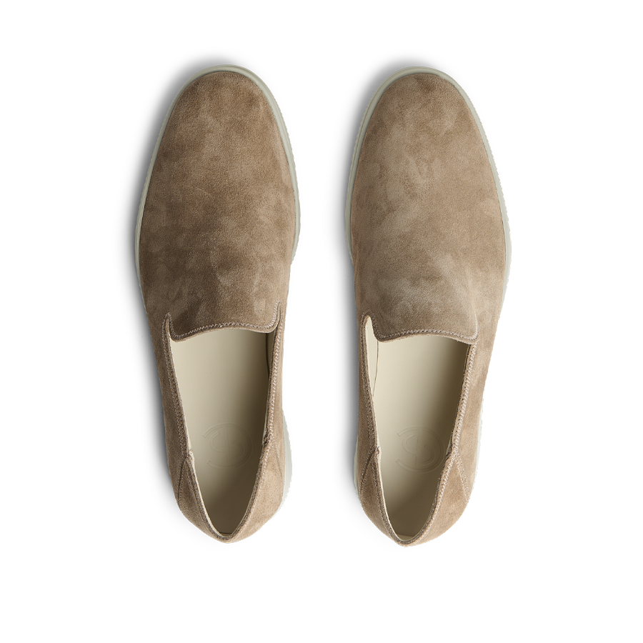 A pair of Brown Tabac Suede Leather Vice Loafers by CQP displayed top-down on a black background.