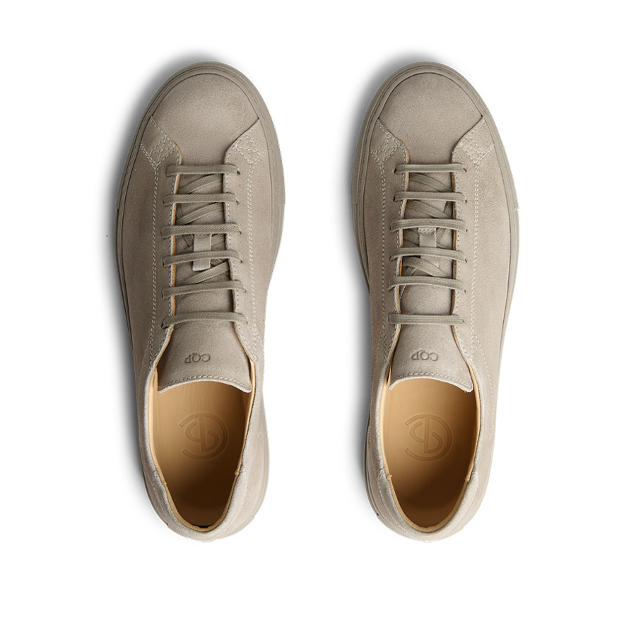 A pair of CQP Khaki Racquet Sr Sneakers in beige suede with a rubber sole.