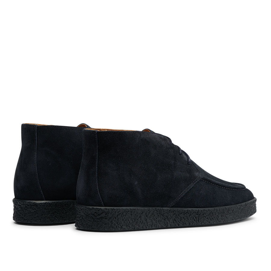 A pair of navy blue suede leather Plana boots with crepe soles, seen from the back and side, by CQP.