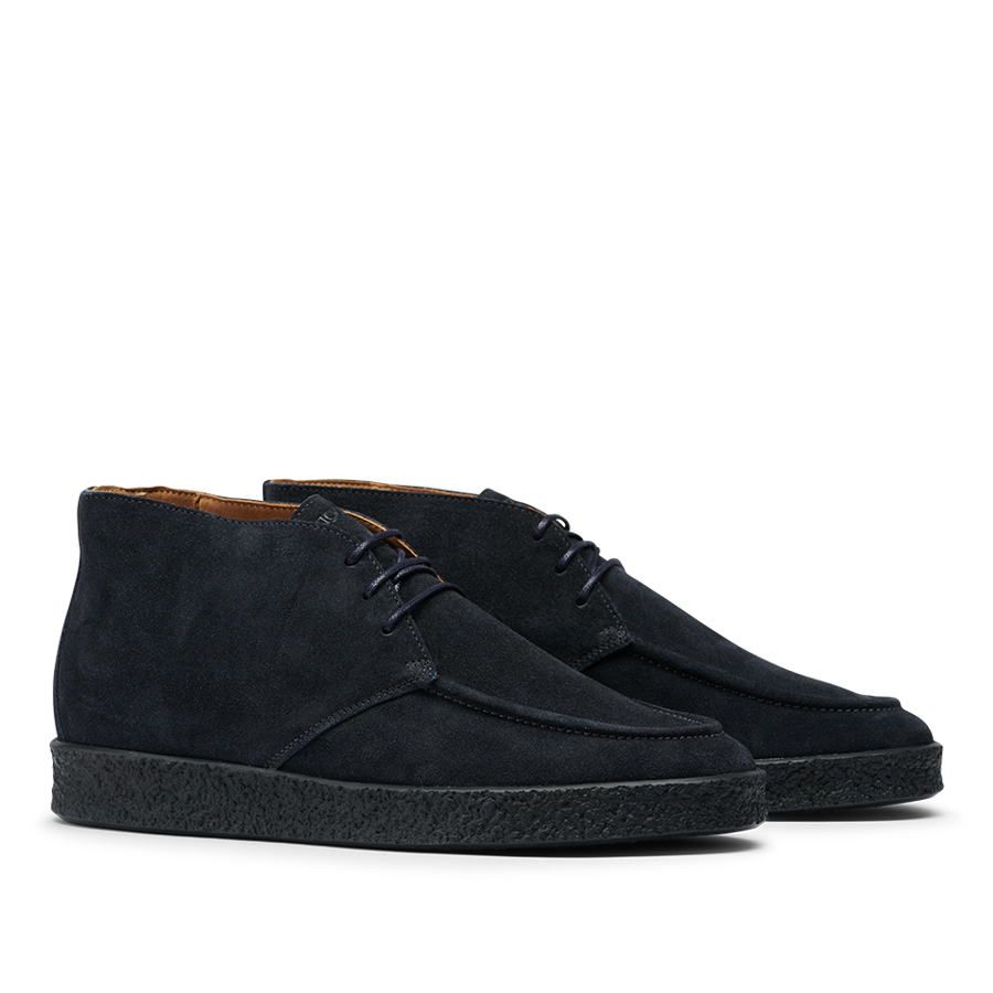 The CQP Navy Blue Suede Leather Plana Boots feature a stylish ankle-high design, complete with crepe soles and laces.
