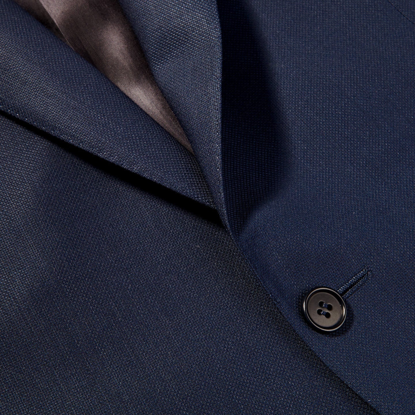 A close up image of the Canali Blue Wool Hopsack Travel Blazer featuring natural stretch.