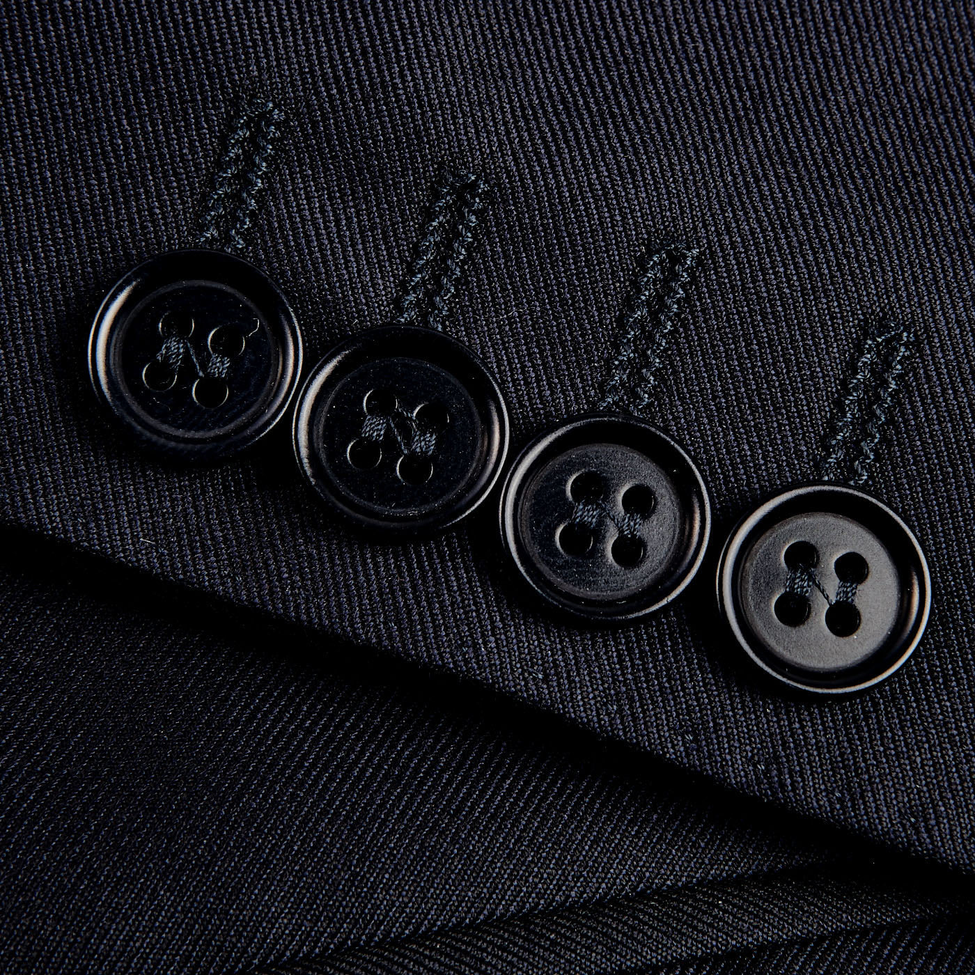 Close up of Canali Navy Blue Wool Notch Lapel Suit with structured shoulders.