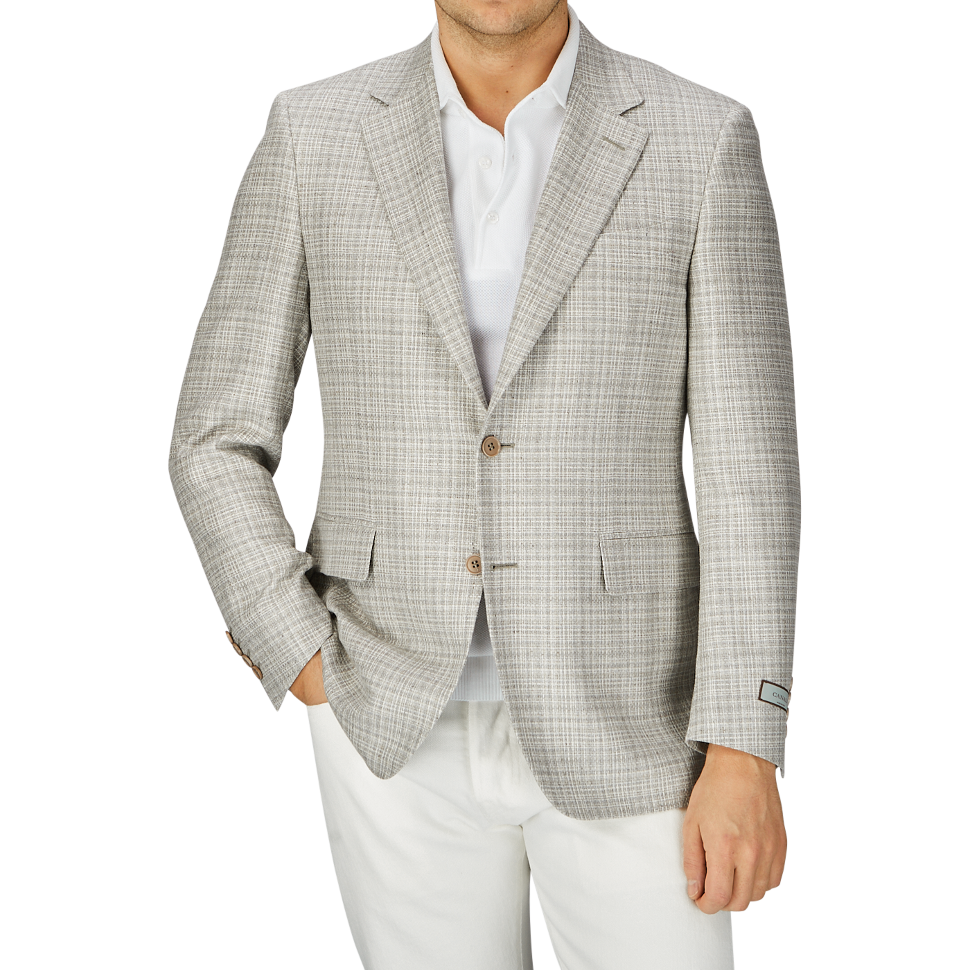 Man in a fitted beige melange silk wool basketweave blazer by Canali over a white shirt, with a partial view of white pants, standing against a grey background.
