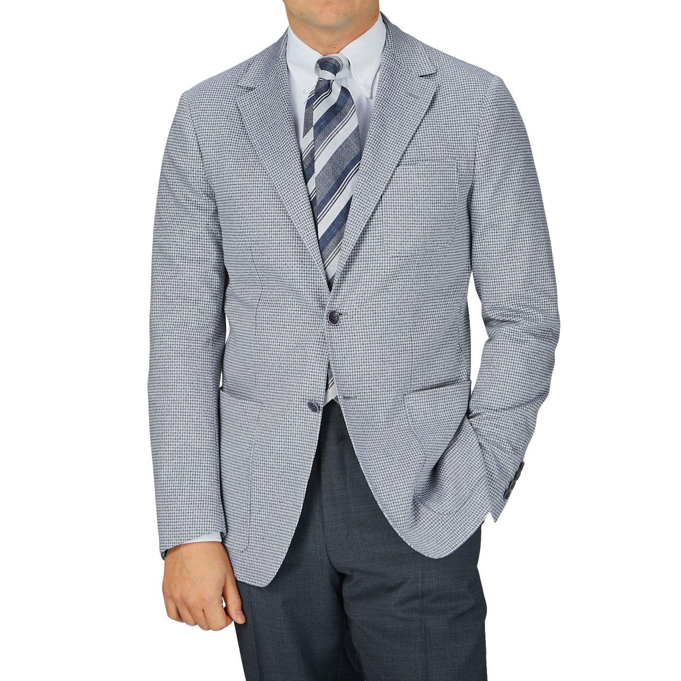 A man is posing in a Canali Light Grey Houndstooth Cotton Jersey Blazer and tie.