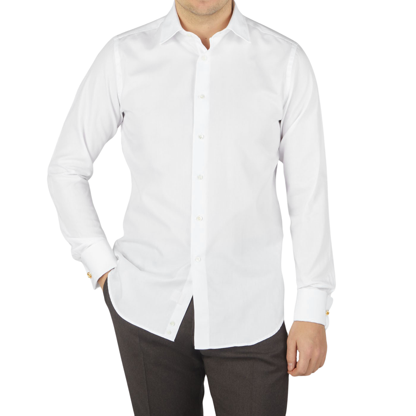 A man wearing a formal shirt, specifically a white Canali dress shirt, paired with brown pants.