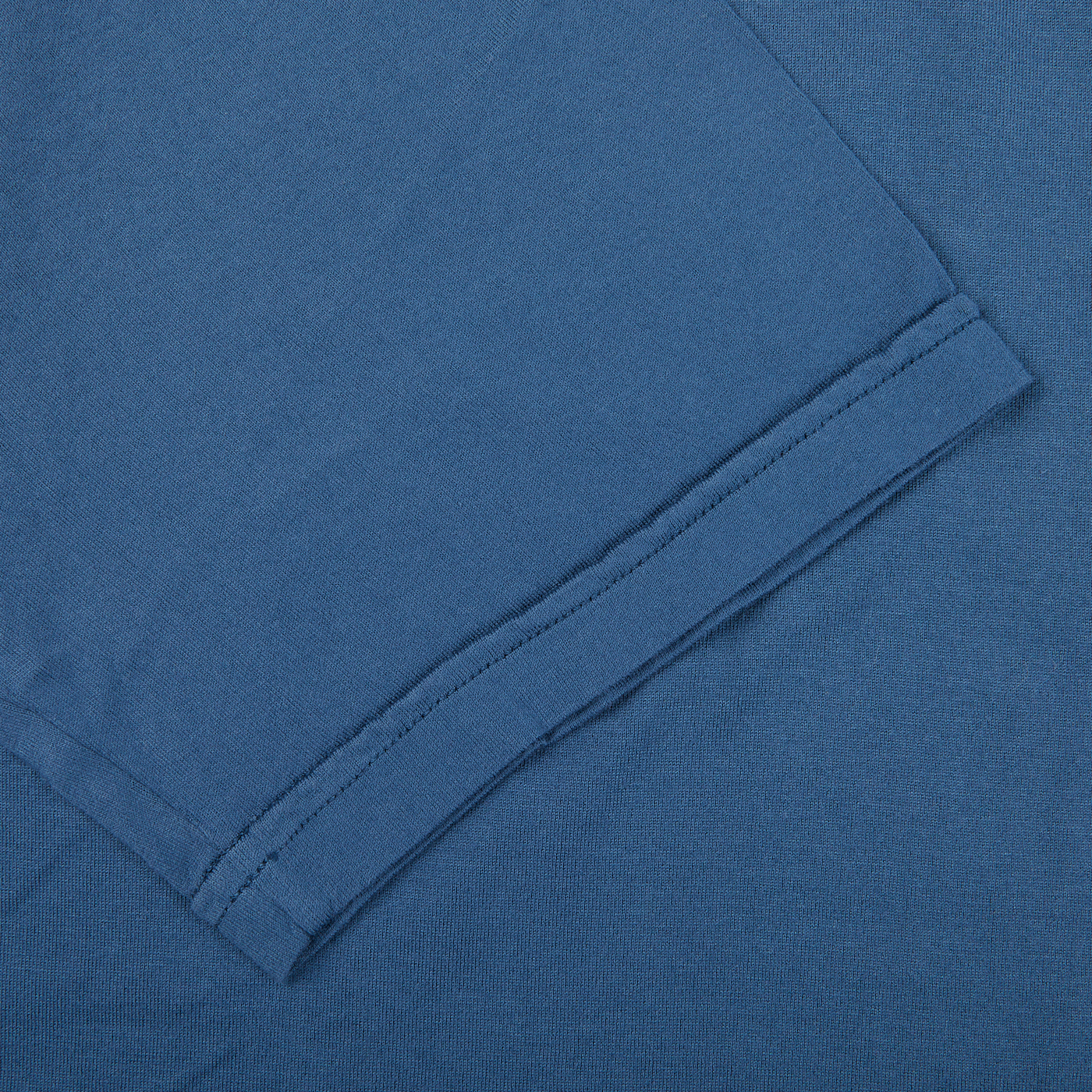A close up of a luxury Fedeli Indigo Blue Organic Cotton T-shirt.