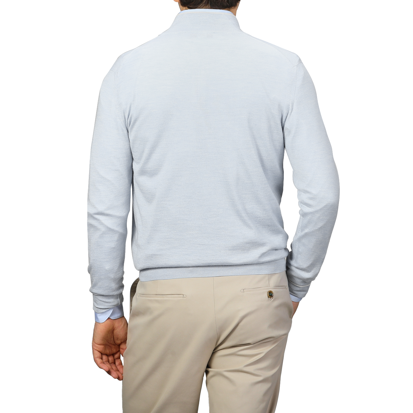The person is seen from the back in a Fedeli Sky Blue Cashmere Silk 1/4 Zip Sweater, paired with beige trousers against a neutral backdrop.