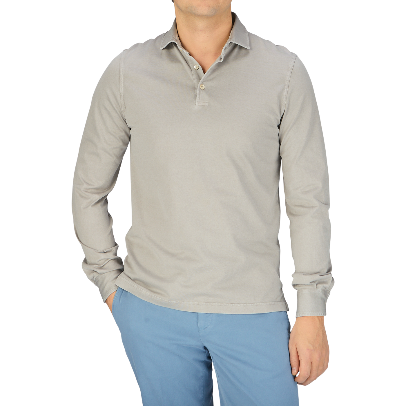 A man wearing a luxury Fedeli Taupe Beige Organic Cotton LS Polo Shirt and blue pants.