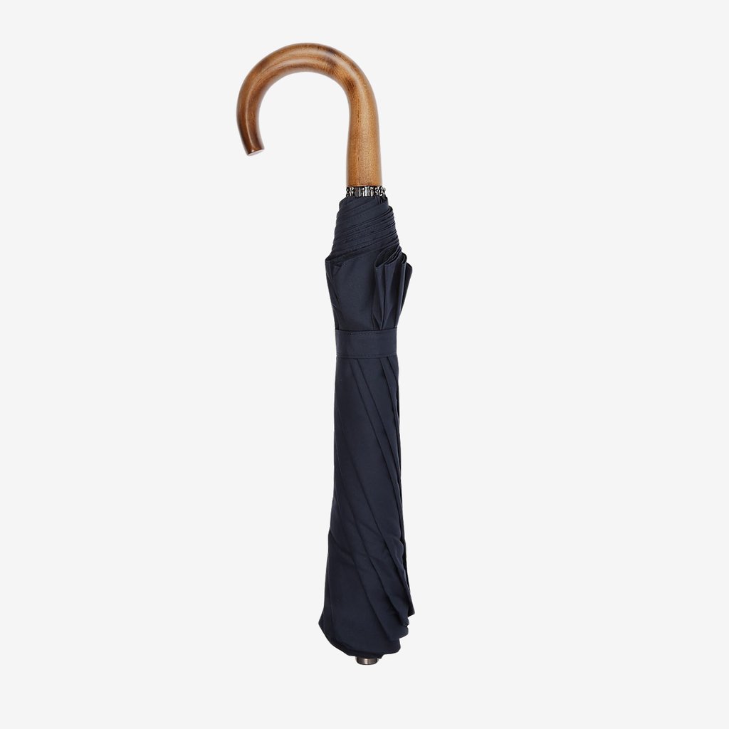 A handmade Navy Telescopic Maple Handle Umbrella by Fox Umbrellas.