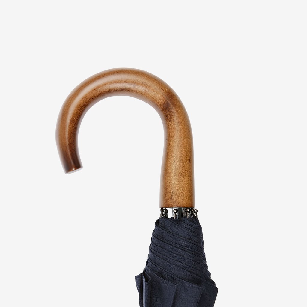 A Navy Telescopic Maple Handle Umbrella by Fox Umbrellas on a white background.