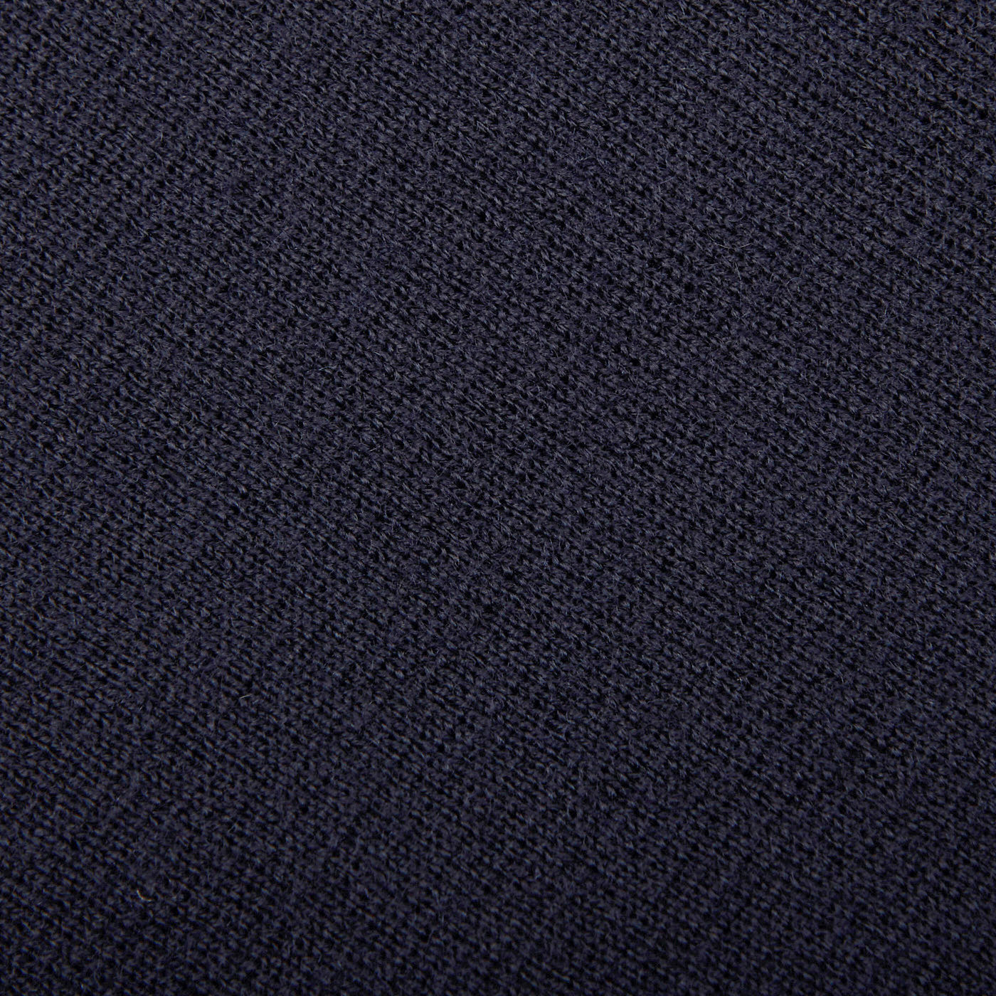 A close up image of a dark blue Gran Sasso-coated background featuring the Navy Blue Rain Wool Knitted Jacket.