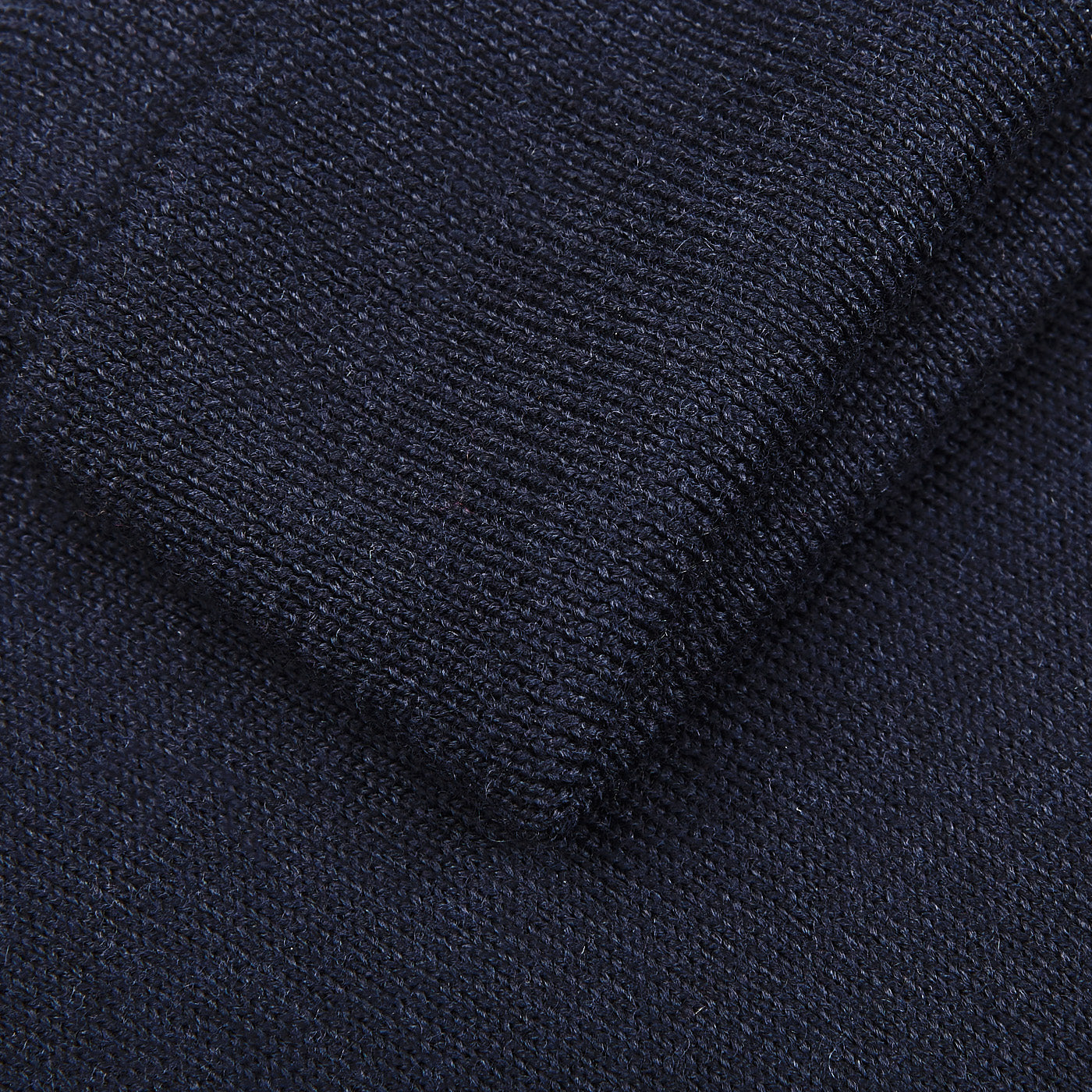 Close-up of Gran Sasso's Navy Blue Extra Fine Merino Wool Rollneck, highlighting the fine knit texture—perfect for a slim fit and crafted from premium thin wool.