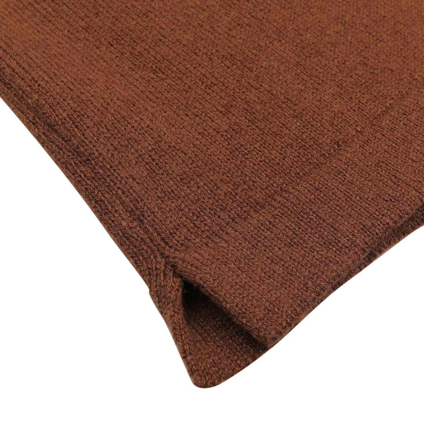 Close-up of a brown knitted fabric, evocative of the intricate texture and corner stitching found on the Gran Sasso Burnt Orange Virgin Wool LS Polo Shirt, set against a white background.