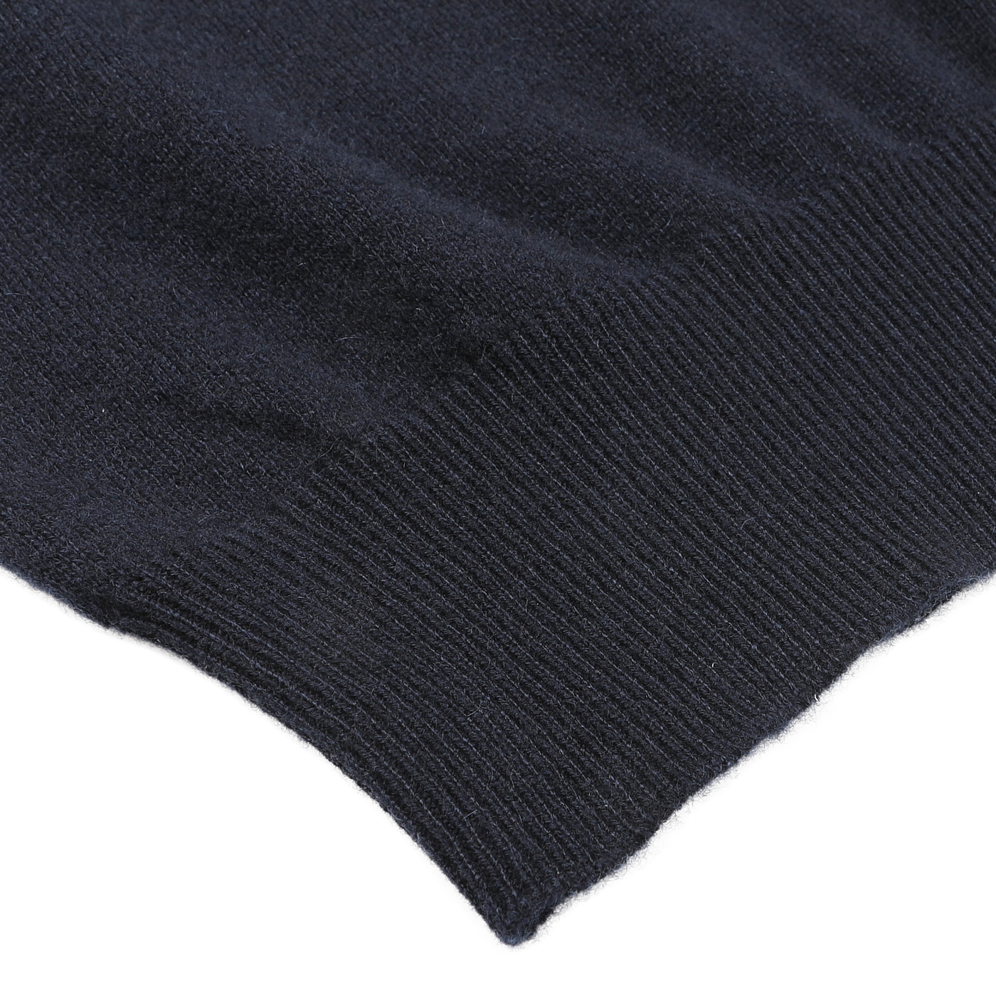 Close-up of the edge of Gran Sasso's Navy Blue Cashmere Crew Neck Sweater, crafted from luxurious cashmere fibers, showcasing the garment's fine ribbing detail.