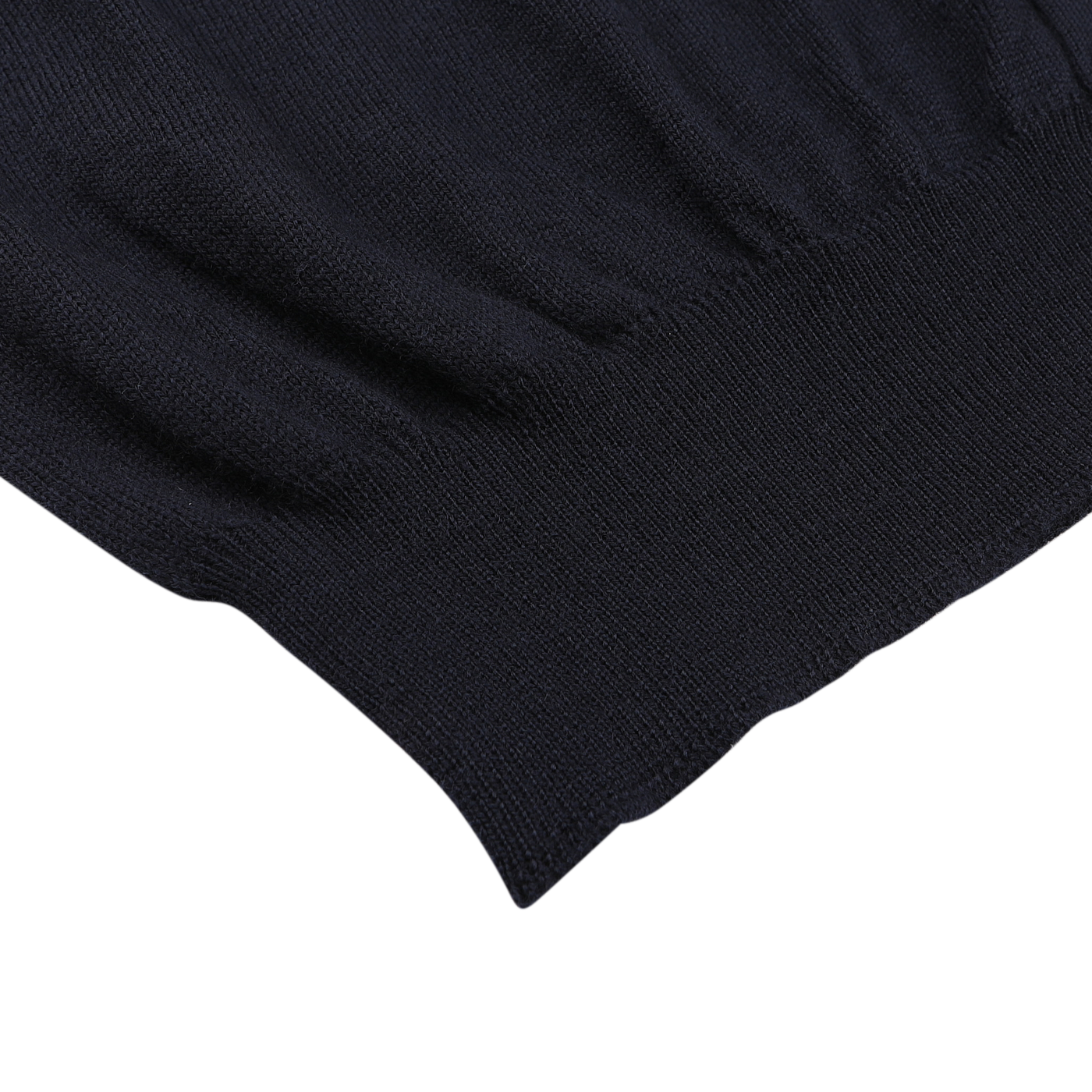 Close-up of Gran Sasso’s navy blue extra fine merino wool vest, highlighting the ribbed hem and soft texture—ideal for layering under any sleeveless cardigan.