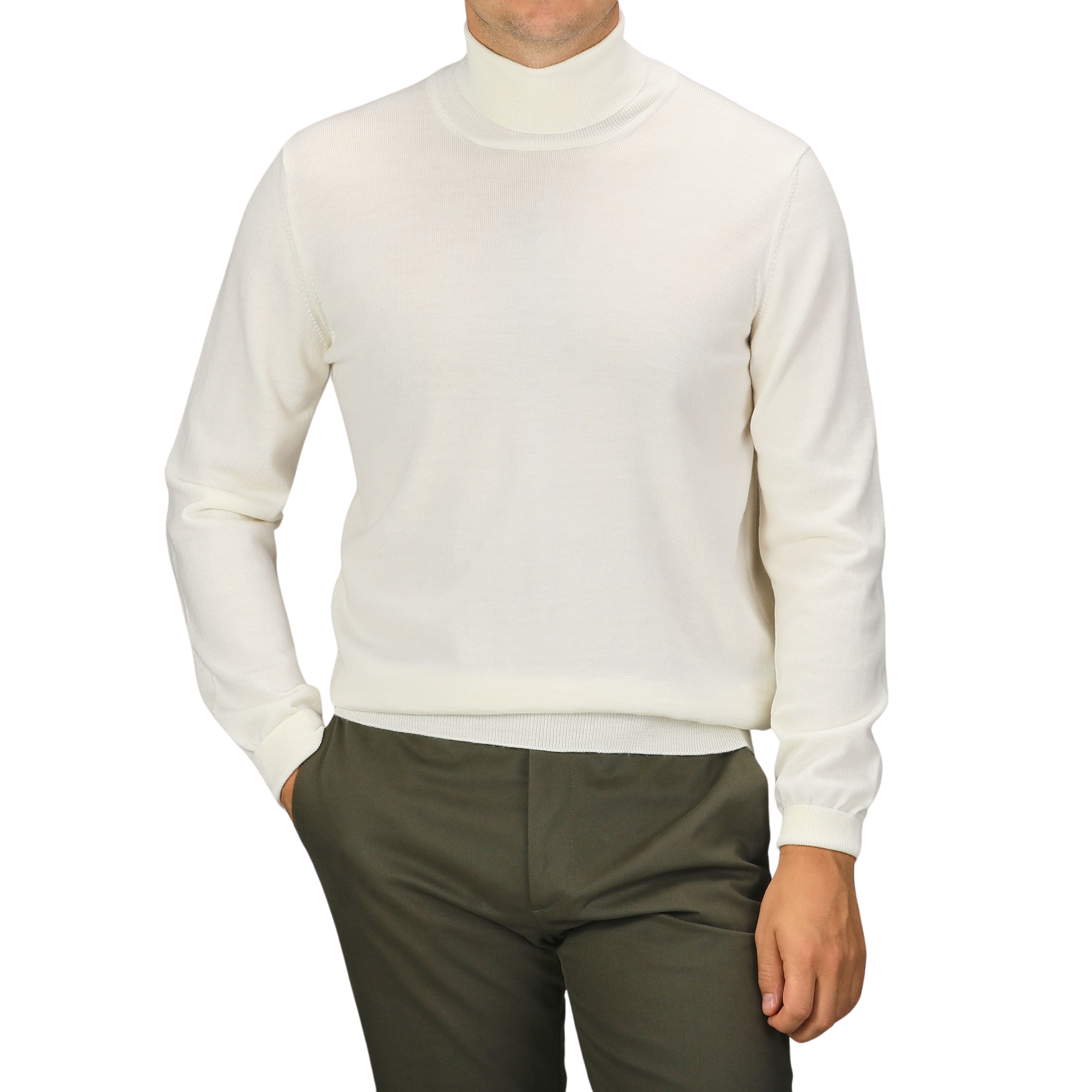 A person wearing an Off White Extra Fine Merino Rollneck by Gran Sasso and olive pants stands with one hand in their pocket against a plain background.