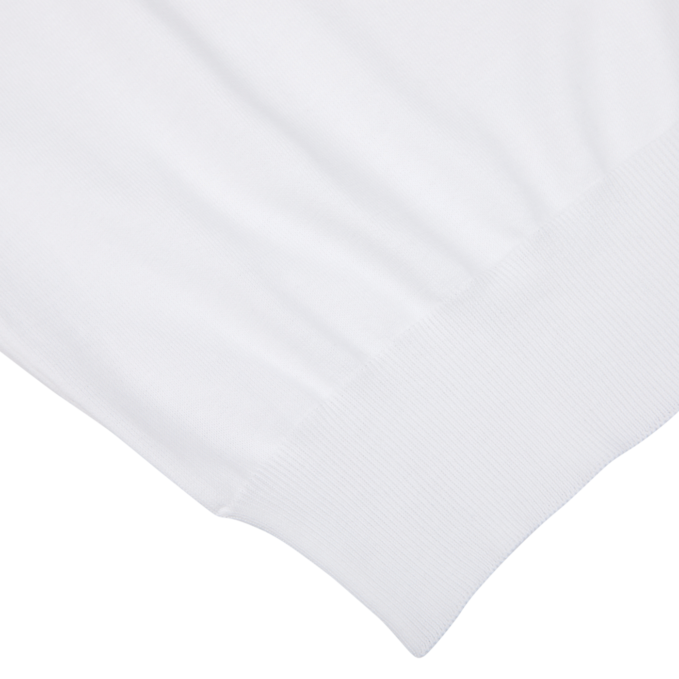 Close-up view of a Gran Sasso white organic cotton t-shirt texture with detailed stitching, focused on the hem.