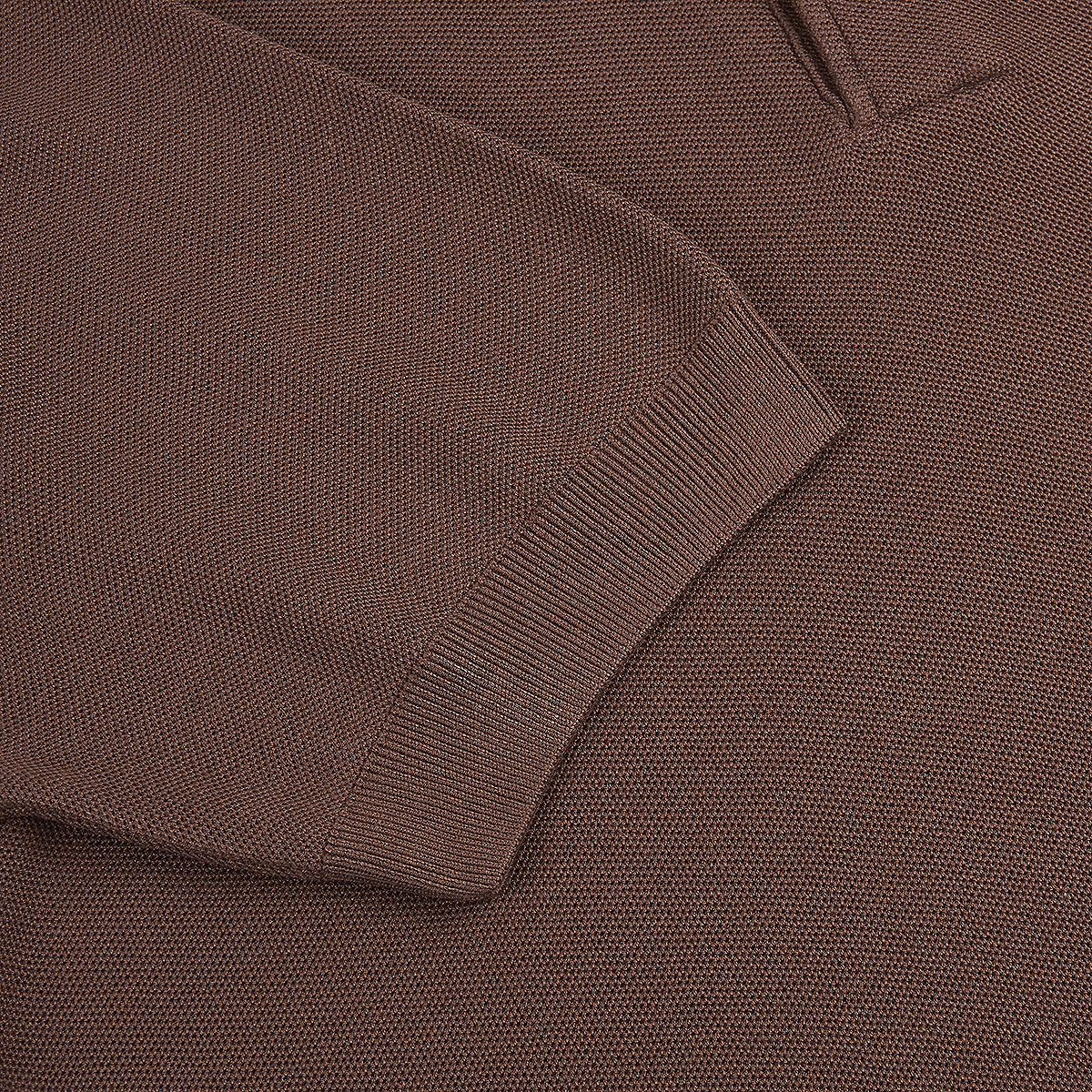 Close-up of the Gran Sasso Brown Silk Pique Short Sleeve Polo, showing its fine waffle-like knit texture and rich medium brown color. The detailed silk pique fabric highlights the brand’s craftsmanship and luxurious feel. , available at Richard Gelding Mayfair
