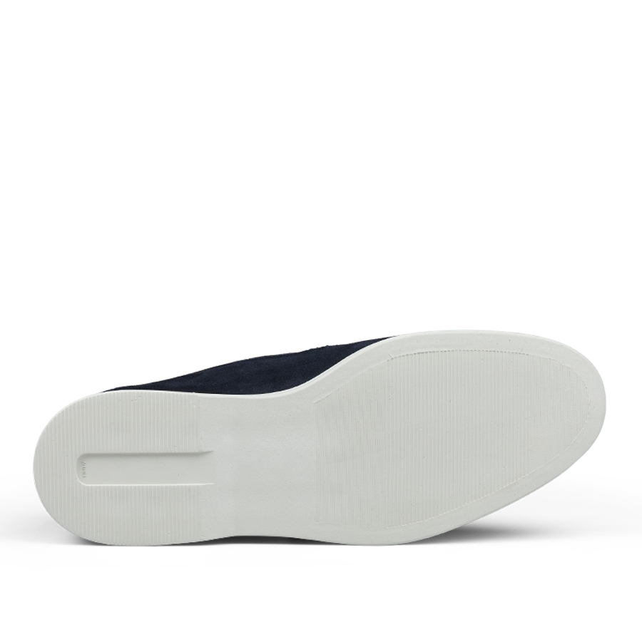 A pair of Herno Dark Blue Suede Slip-on Loafers with white soles, viewed from the bottom.