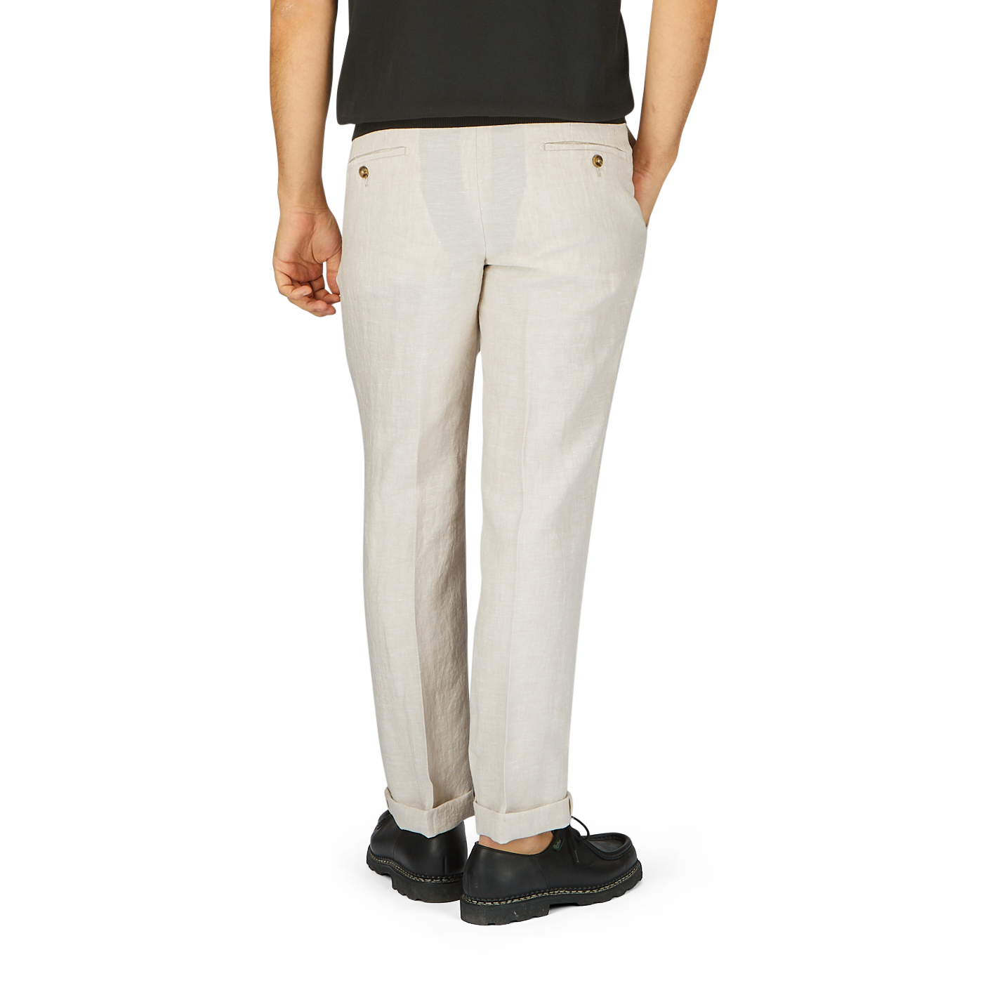 Back view of a person wearing Light Beige Washed Linen Regular Fit Chinos by Hiltl and black shoes, standing against a gray background.