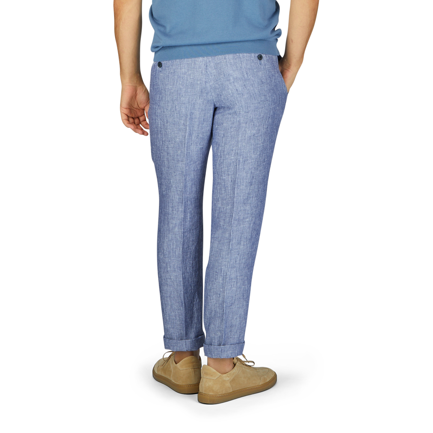 Man wearing Hiltl light blue washed linen regular fit chinos, and beige shoes, standing with his left side facing the camera, isolated on a white background.