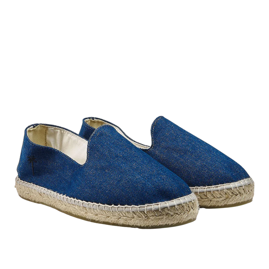 A pair of Dark Jeans San Francisco Denim Espadrilles by Manebi on a white background.