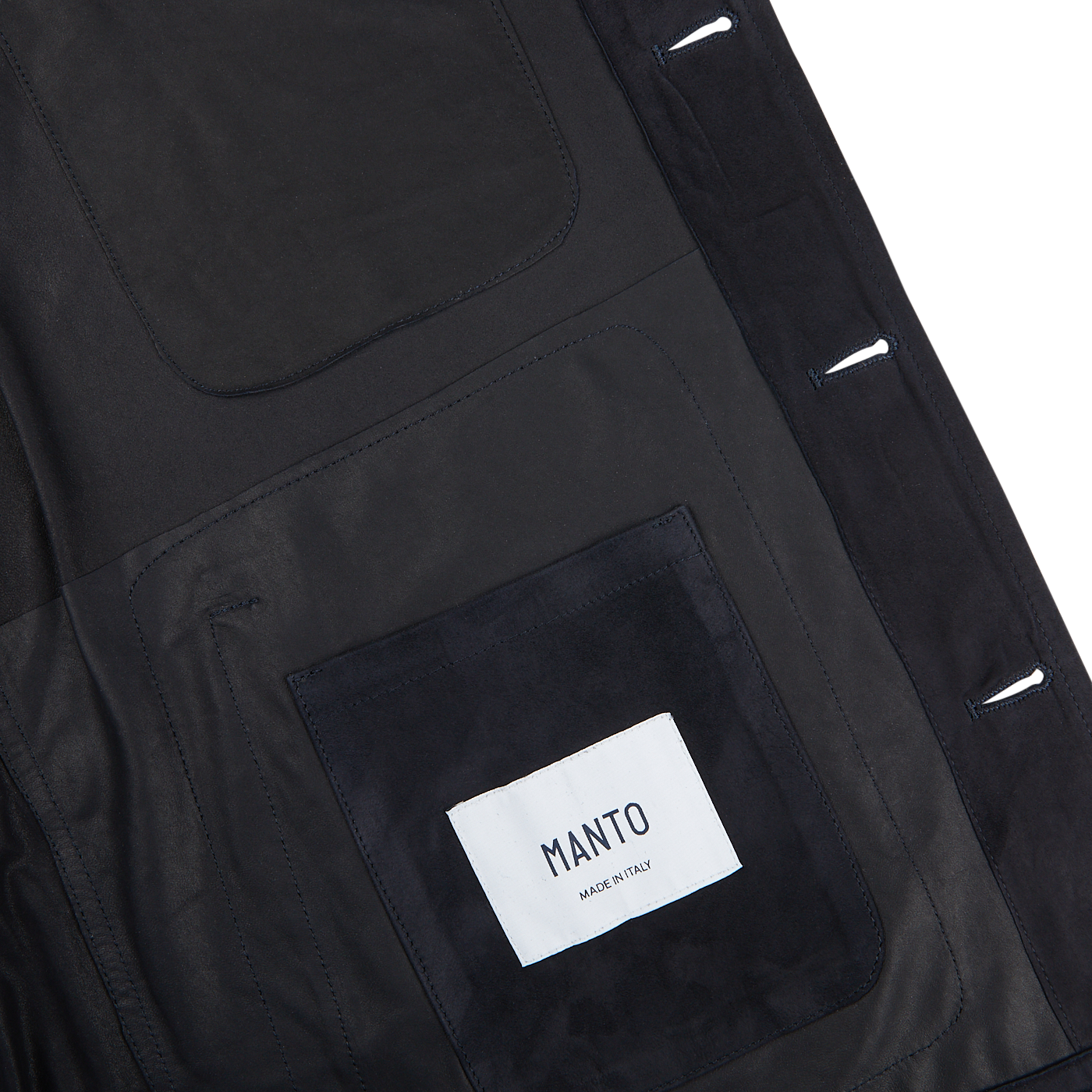 The back of a Manto navy blue suede leather overshirt with a label on it.