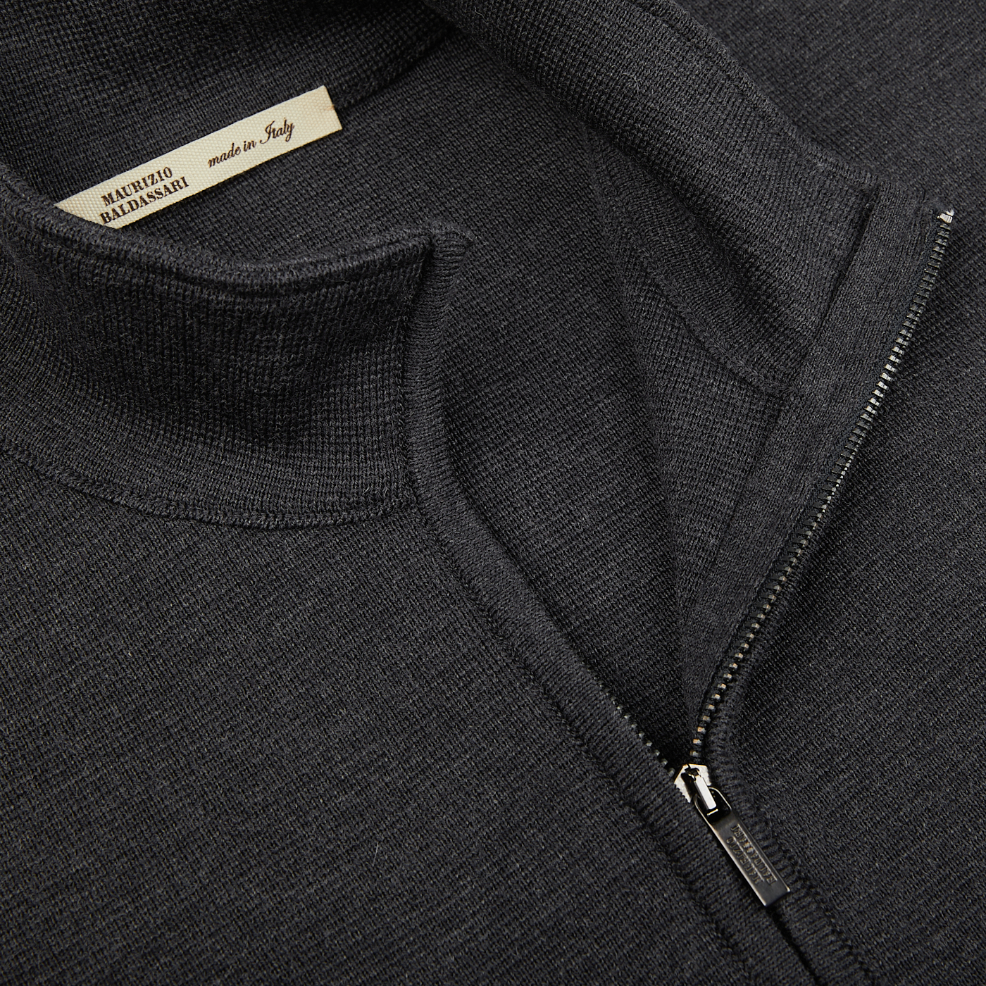 A close up of a charcoal grey Maurizio Baldassari Milano Stitch Wool Zip Gilet.