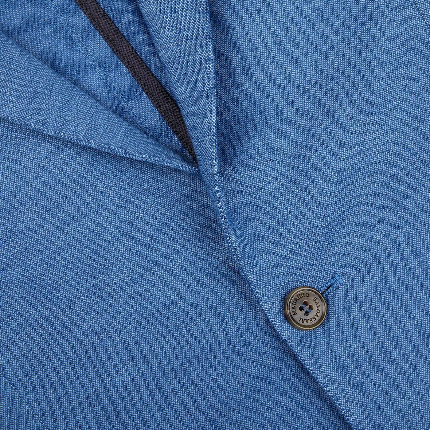 A Maurizio Baldassari light blue wool linen silk jersey blazer, suitable for both seasonal casual occasions, crafted with a blend of wool and silk and featuring buttons.