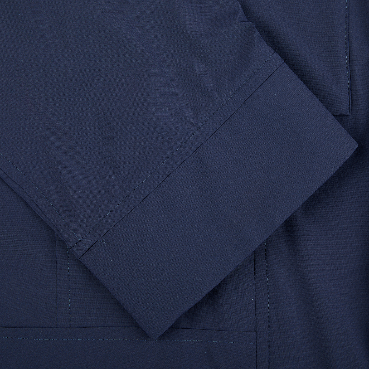 A close up of a Moorer Dark Blue Lightweight Nylon Field Jacket with pockets.
