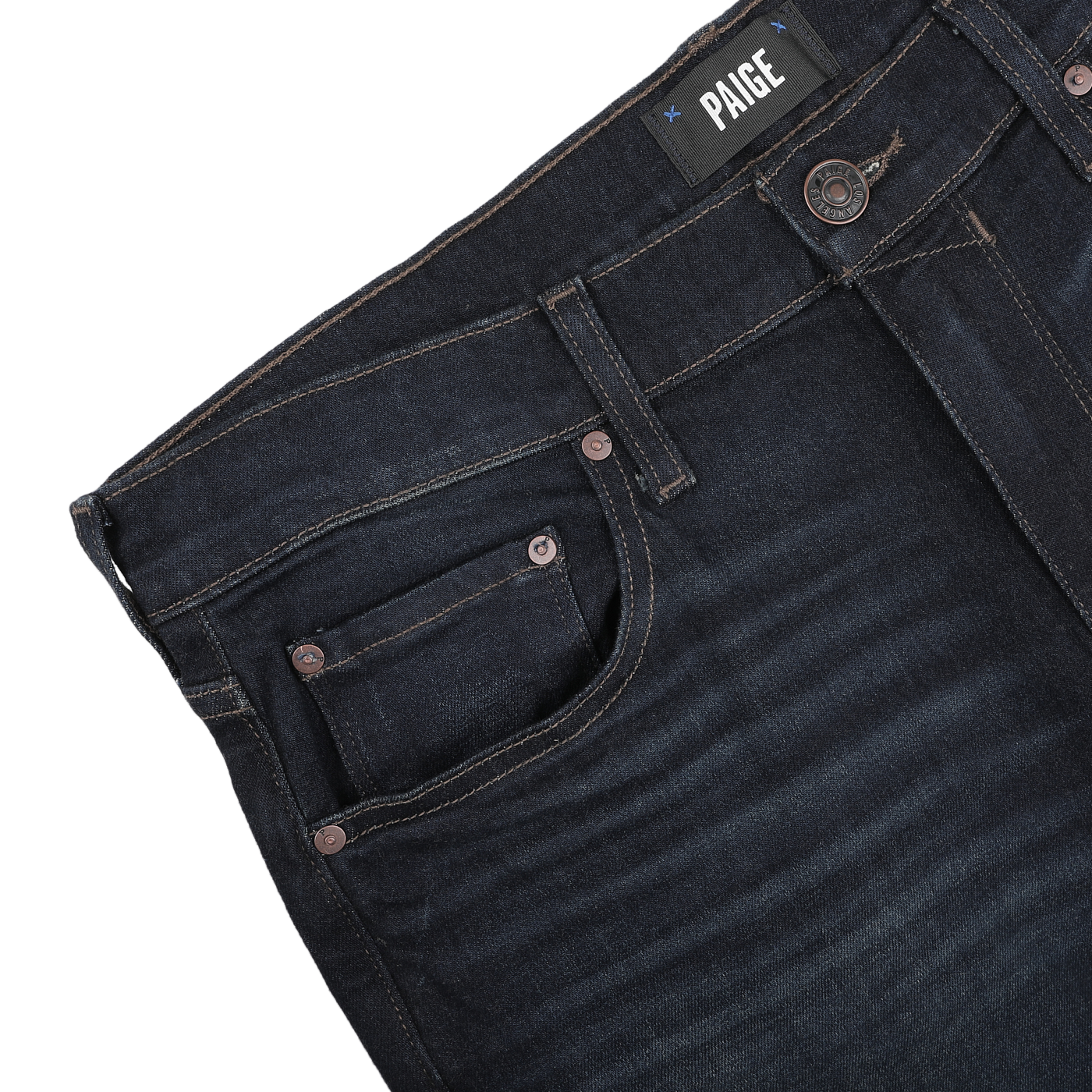 Close-up of dark blue denim Blue Faded Cotton Cramer Normandie Jeans featuring a visible "Paige" label on the waistband, showcasing front pocket and button details. These straight-leg jeans incorporate a hint of cotton stretch, providing comfort and style throughout the day.