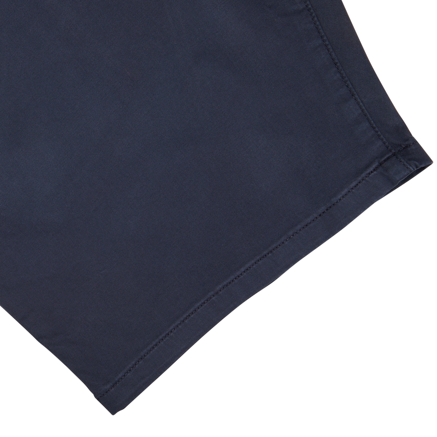 Close-up of a Paige Navy Blue Cotton Blend Phillips Shorts fabric with stitched hem on a white background.