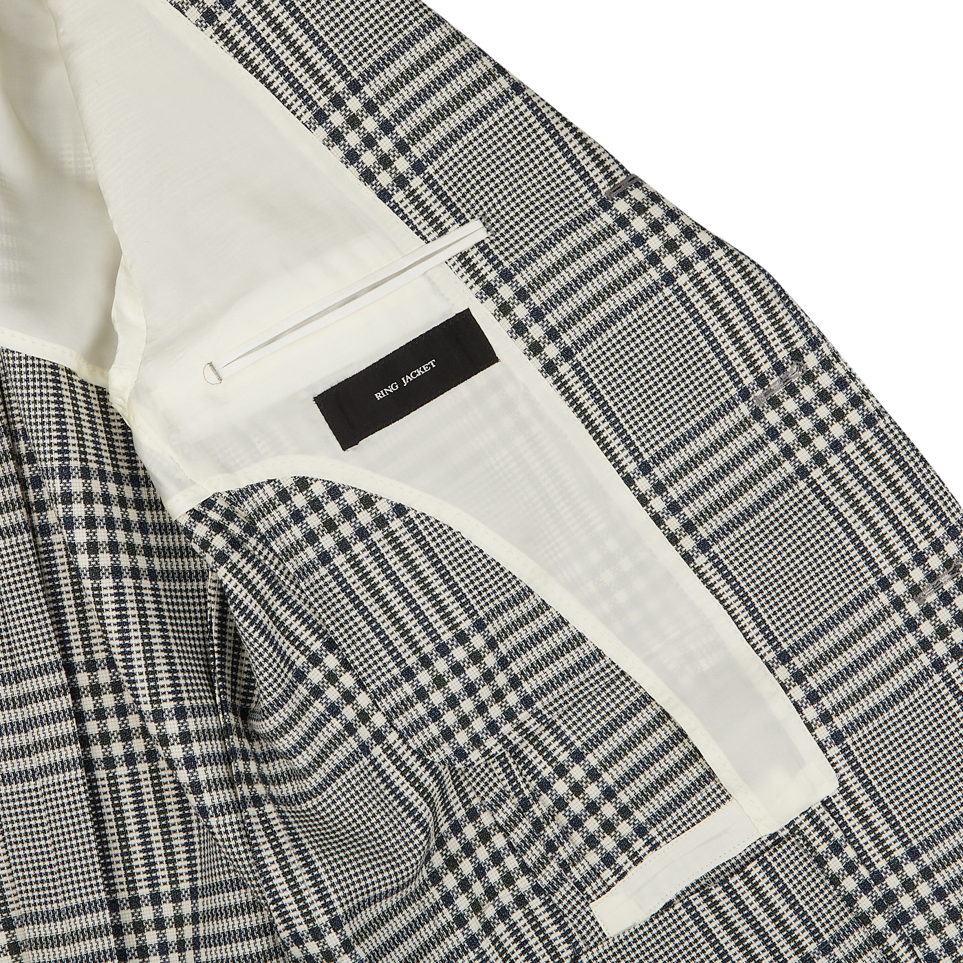Close-up of a black and white checkered Ring Jacket with a white inner lining and a visible brand label reading "Ring Jacket".