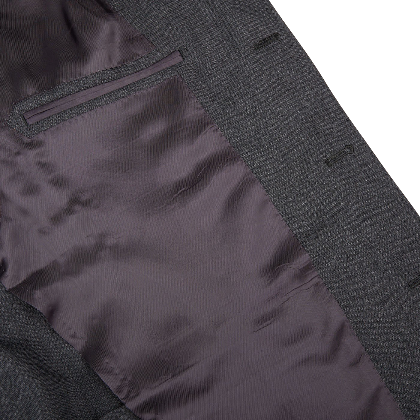 Close-up of a Ring Jacket Dark Grey High Twist Wool Suit jacket crafted from wool fresco fabric, with detail of inner lining and pockets, displayed on a white background.