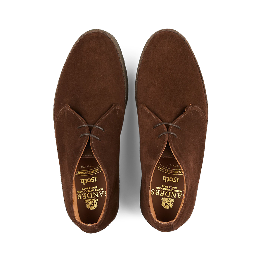A pair of Polo Snuff Suede Hi Top Boots by Sanders with a rubber crepe sole, viewed from above.