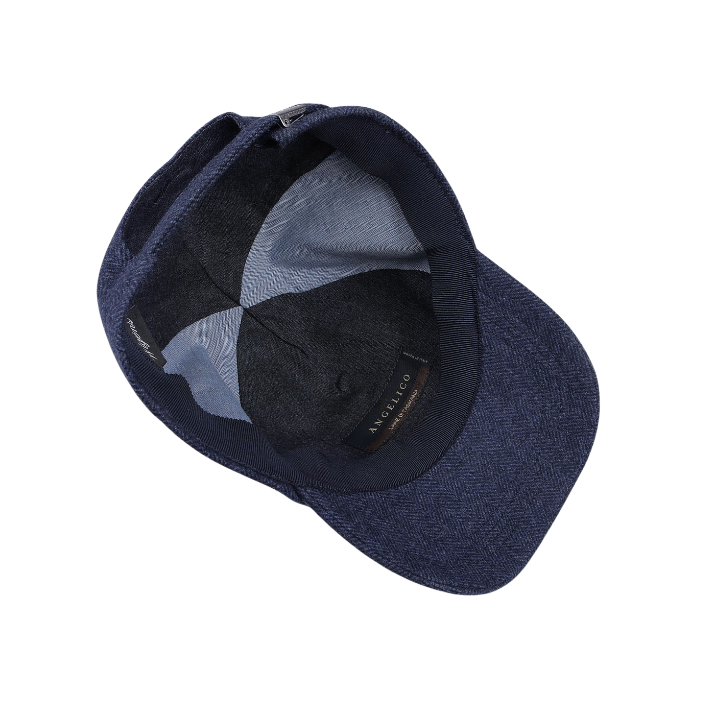 Top-down view of the interior of the Blue Herringbone Angelico Wool Baseball Cap by Wigéns, featuring a fabric-lined brim, visible stitching, and an adjustable strap.