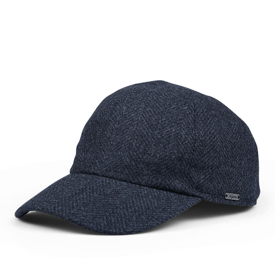 The Wigéns Dark Blue Herringbone Loro Piana Wool Baseball Cap features a textured fabric and a small metal brand tag on the side.