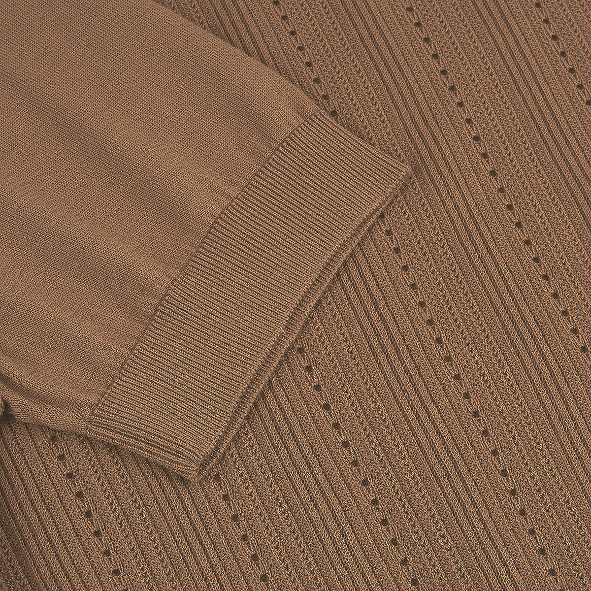 Close-up of the Caramel Brown Diamond Cotton Polo by Altea, showing cotton knit fabric with vertical textured lines and small holes, contrasted by a tightly ribbed cuff for added depth and style. , available at Richard Gelding Mayfair