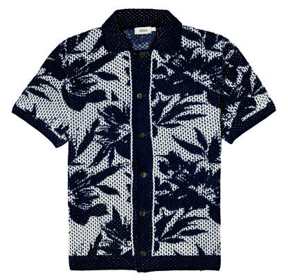 The Altea Navy Cream Cotton Flower Open Weave shirt is a short-sleeved, button-up knit made from breathable navy and cream cotton with a floral open-weave pattern, solid navy accents, and an Alice label inside the collar. , available at Richard Gelding Mayfair