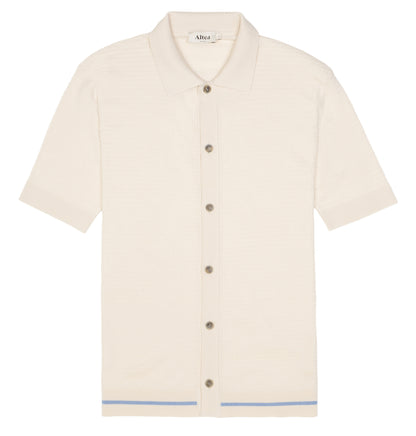The Altea Cream Blue Trim Waffle Cotton Button Polo is a refined men’s casual shirt with short sleeves, a buttoned collar, and a subtle blue stripe near the hem—perfect for everyday style. , available at Richard Gelding Mayfair