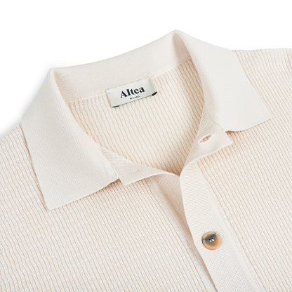 Close-up of Altea Cream Blue Trim Waffle Cotton Button Polo, featuring textured cotton, pointed collar, partial button placket with tan button. Shirt is laid flat on a white background. "Altea Milano" label appears inside the collar. , available at Richard Gelding Mayfair