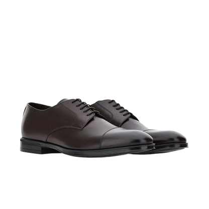 The Canali Brown Calf Derby Shoes feature polished dark brown leather, black laces, a cap toe design, and an all-weather rubber sole. Displayed on a white background. , available at Richard Gelding Mayfair
