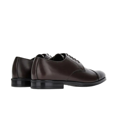 Canali Brown Calf Derby Shoes feature polished dark brown leather, black rubber soles for all-weather grip, low heels, and closed laces. Shown at a slight angle against a plain white background for a classic look. , available at Richard Gelding Mayfair
