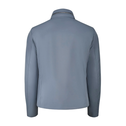 The Navy Blueberry Nylon Alcide Blouson by Moorer is shown from the back in light navy, featuring long sleeves, a high collar, and straight hem. Its sleek, minimalist retro design has no visible seams or fasteners against a plain white background. , available at Richard Gelding Mayfair