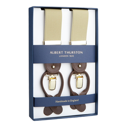 A pair of handmade Albert Thurston Dark Beige Nylon Elastic 35mm braces in a presentation box, highlighting their English craftsmanship.