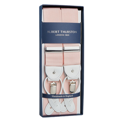 Light Pink Albert Thurston suspenders, crafted from stretchable nylon fabric, in a blue gift box labeled "Handmade in England.